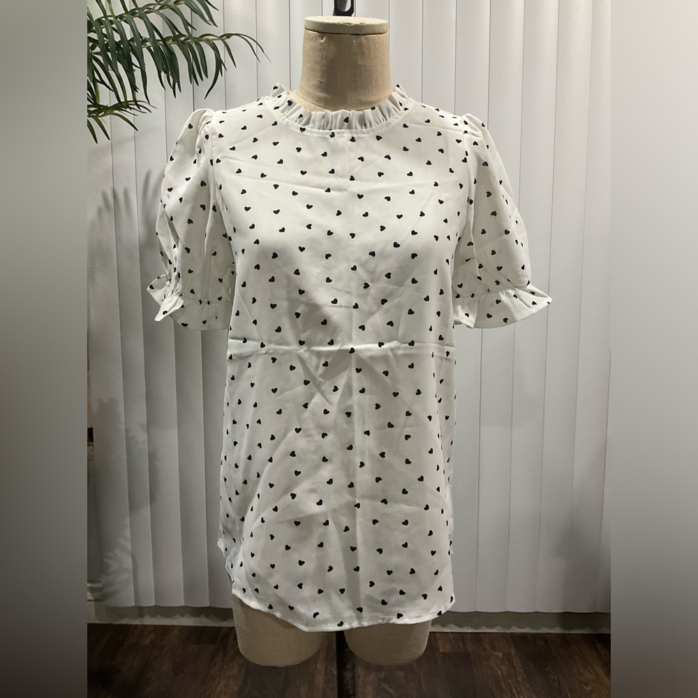 White blouse with black hearts